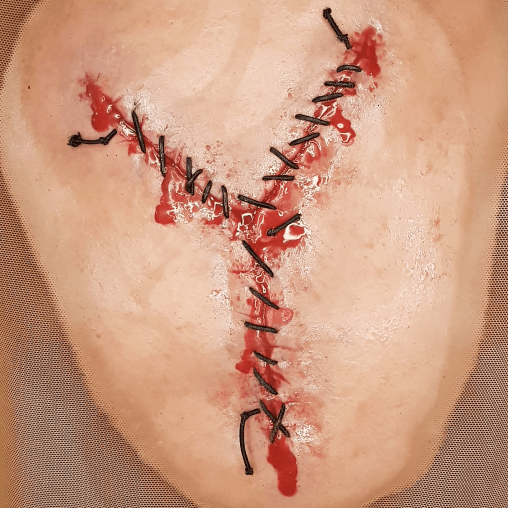 Stitched fresh autopsy scar silicone prosthetic close-up