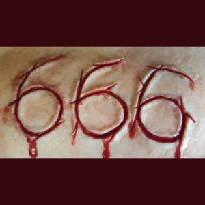 666 carved into flesh silicone prosthetic