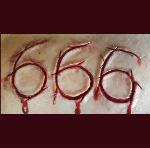 666 carved into flesh silicone prosthetic